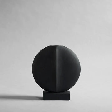 A 101Cph Guggenheim Mini Black 111126 by 101 Copenhagen on a white background that adds a whimsical touch to any interior setting.