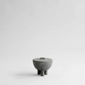 Concrete bowl with lid on a light gray background from 101 Copenhagen at Spacio retail stores in Mumbai & Kolkata. 