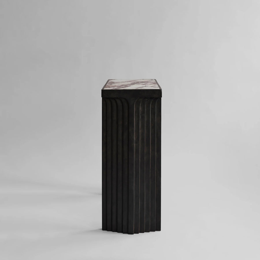 Side view of fibre concrete and calacatta marble top console from 101 Copenhagen at Spacio retail stores in Mumbai & Kolkata. 