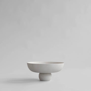 White ceramic bowl on a light gray background from 101 Copenhagen at Spacio retail stores in Mumbai & Kolkata. 
