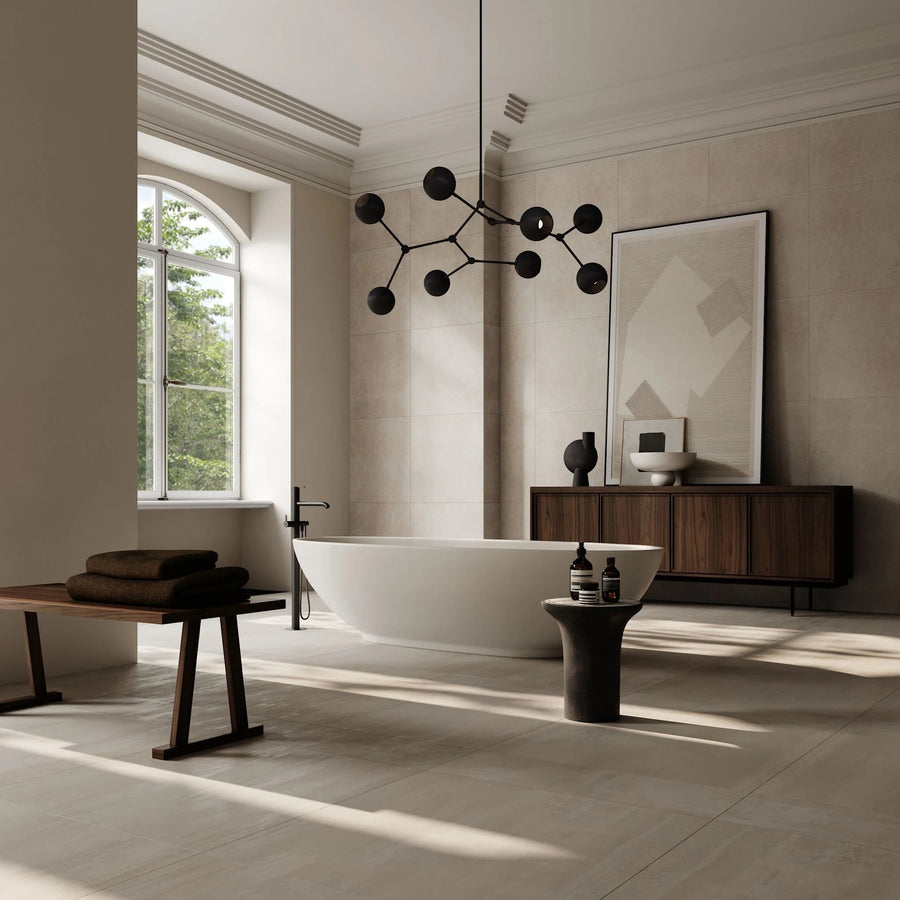 Modern bathroom with a freestanding bathtub, wooden cabinet, and decorative elements.