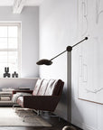 A dark grey living room with a 101Cph Cobra Uno Mini Dark Grey 211032 ceramic lamp by 101 Copenhagen.