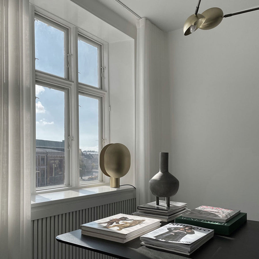 A room with a 101Cph Duck Fat Dark Grey 111281 desk, books, and a window decorated in dark grey color.