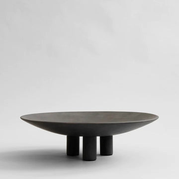 A black 101Cph Duck Plate Big Coffee 214049 by 101 Copenhagen on a white background with a Scandinavian home aesthetic.