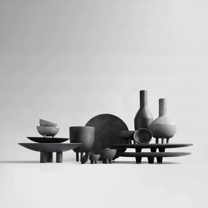 A group of 101 Copenhagen Duck Plate Big Coffee 214049 vases and bowls on a white background, perfect for Scandinavian home decor.