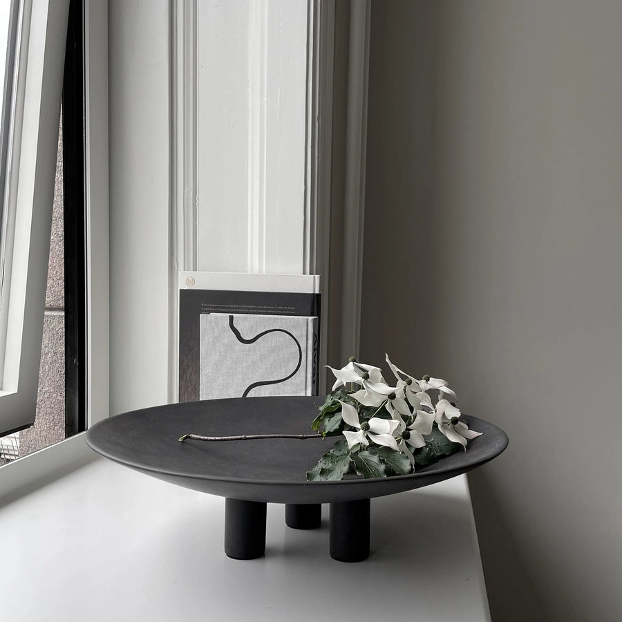 A 101Cph Duck Plate Big Coffee 214049 by 101 Copenhagen sits on top of a window sill in a Scandinavian home.