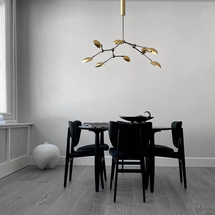 A Scandinavian home with a 101Cph Duck Plate Big Coffee 214049 dining table and chairs by 101 Copenhagen.