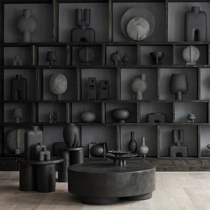 A room with many black 101Cph Duck Plate Mini Coffee 214048 vases and a coffee table in a Scandinavian home.