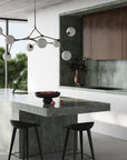 A modern kitchen with 101Cph Duck Vase Slim Terracotta 213044 by 101 Copenhagen counter tops.