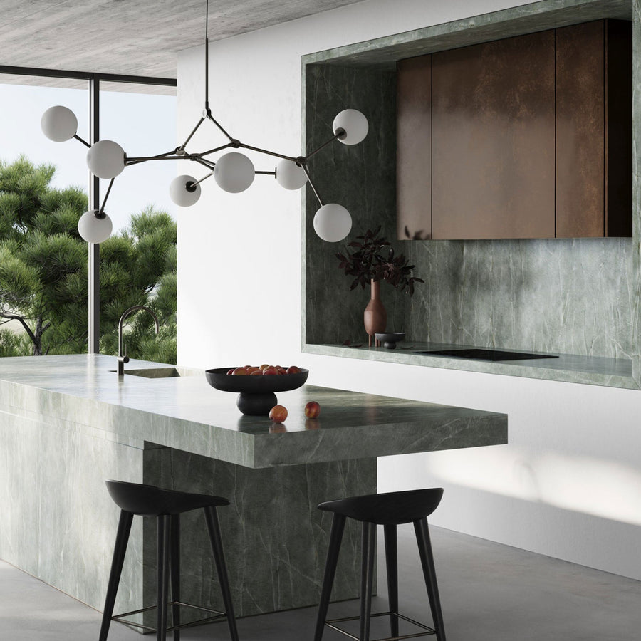 A modern kitchen with 101Cph Duck Vase Slim Terracotta 213044 by 101 Copenhagen counter tops.