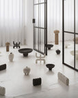 A room filled with 101Cph Empire Mini Sand 223037 vases in various shapes and sizes.