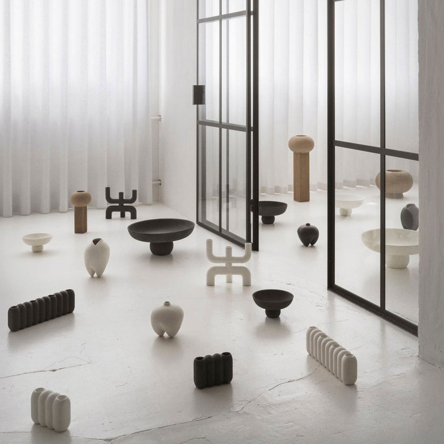 A room filled with 101Cph Empire Mini Sand 223037 vases in various shapes and sizes.