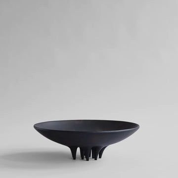 A black Medusa Tray Big Coffee 221063 by 101Cph Copenhagen sitting on top of a white surface, resembling a coffee tray.