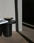 A 101Cph Medusa Tray Mini Coffee 221064 side table with a book on it.