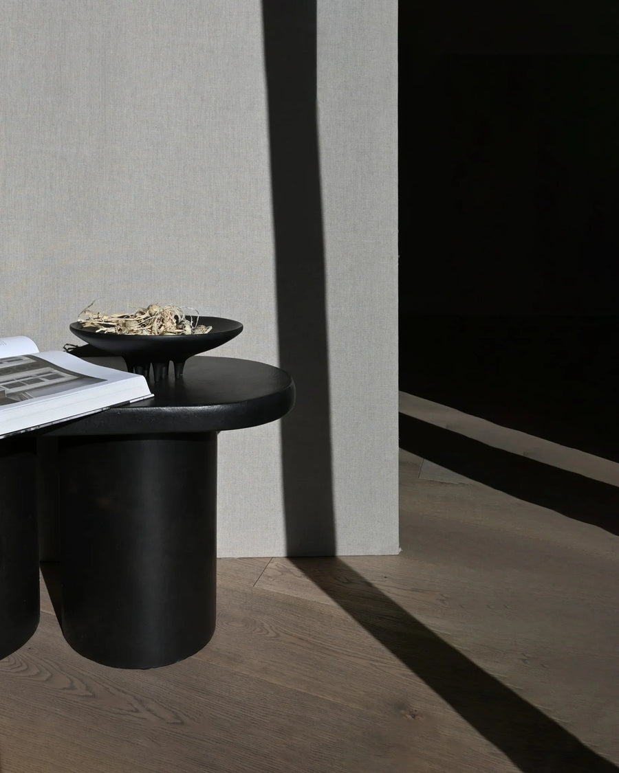 A 101Cph Medusa Tray Mini Coffee 221064 side table with a book on it.