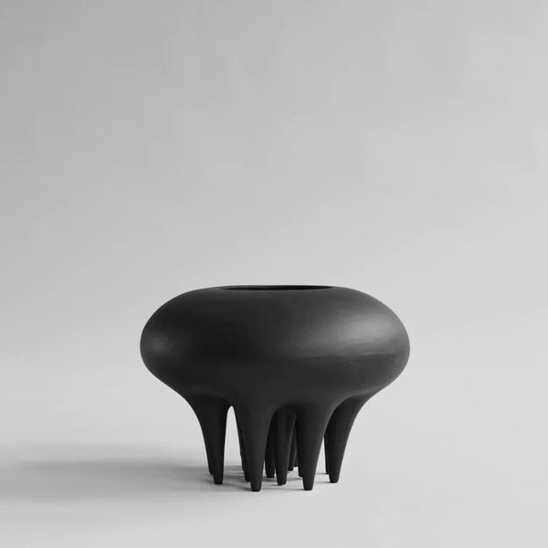 A 101Cph Medusa Vase Big Coffee 221061 by 101 Copenhagen sitting on top of a white surface.