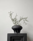 A 101Cph Medusa Vase Mini Coffee 221062 by 101 Copenhagen sits on top of a white box.