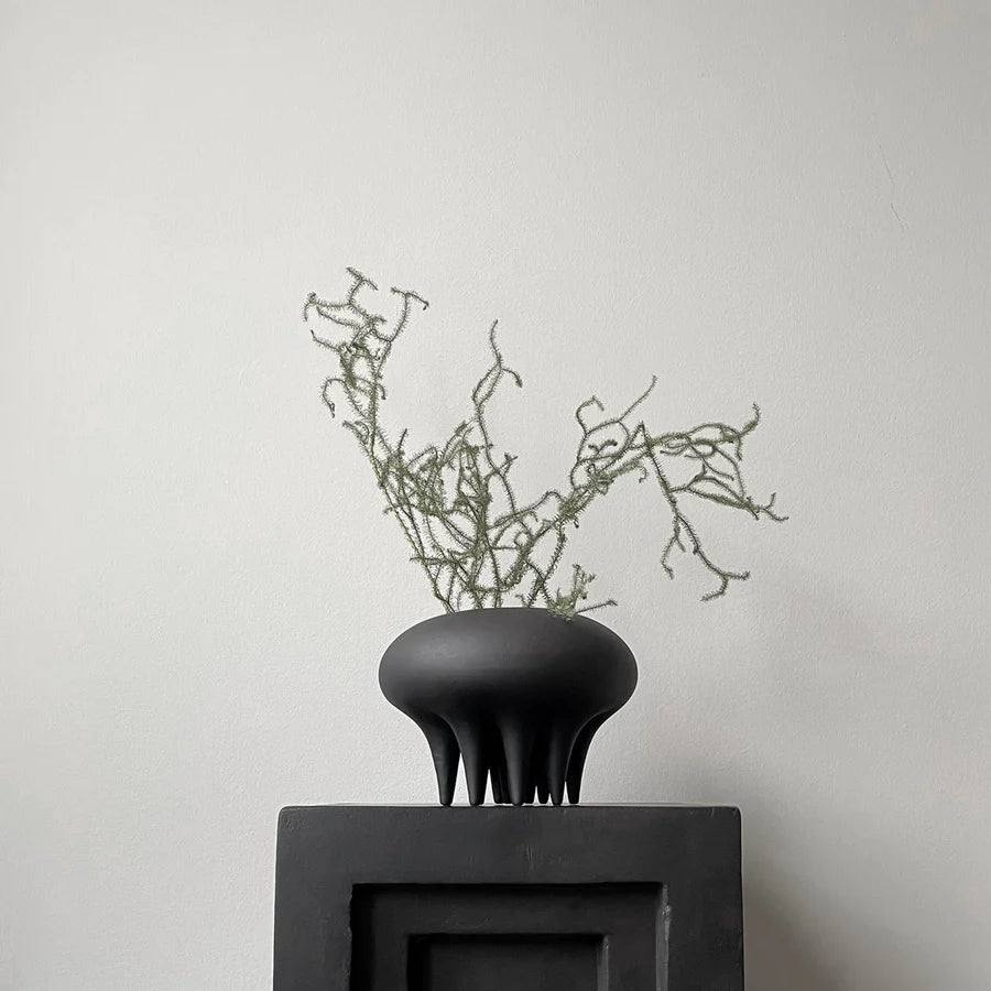 A 101Cph Medusa Vase Mini Coffee 221062 by 101 Copenhagen sits on top of a white box.