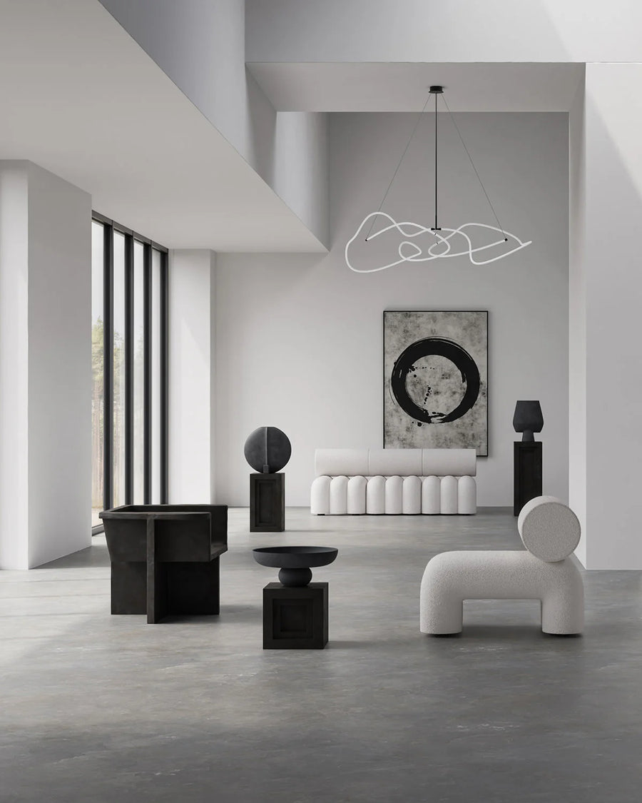 Modern interior with black and white furniture and abstract art from 101 Copenhagen
