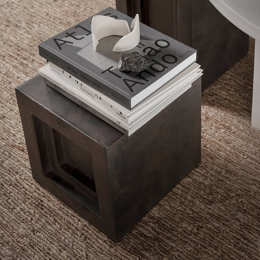 Stack of coffee table books on a small coffee colour pedestal (plinth) from 101 Copenhagen at Spacio retail stores in Mumbai & Kolkata. 