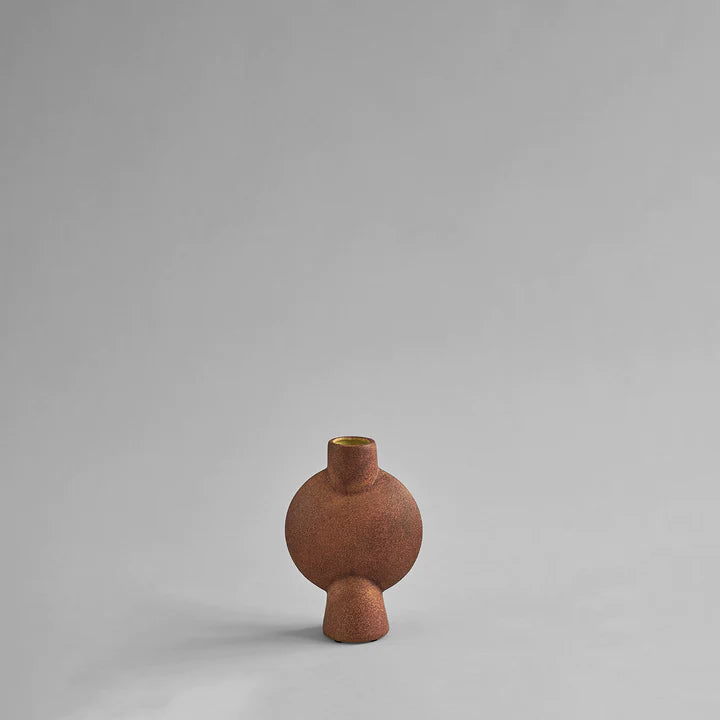 A 101Cph Sphere Bubl Mini Terracotta 203010 vase on a grey background by 101 Copenhagen.
