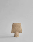 A small 101Cph Sphere Square Shisen Mini Sand 231016 vase with a sand finish on a grey background by 101 Copenhagen.