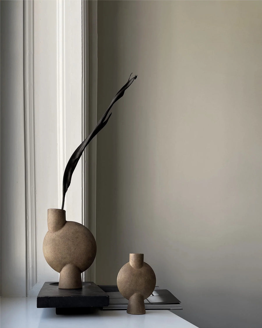 Two ceramic vases on a windowsill with a plain wall background from 101 Copenhagen at Spacio retail stores in Mumbai & Kolkata. 