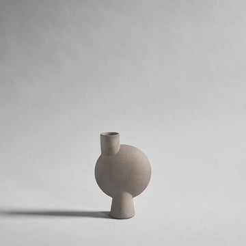 Ceramic sculptural vase on a gray background from 101 Copenhagen at Spacio retail stores in Mumbai & Kolkata. 