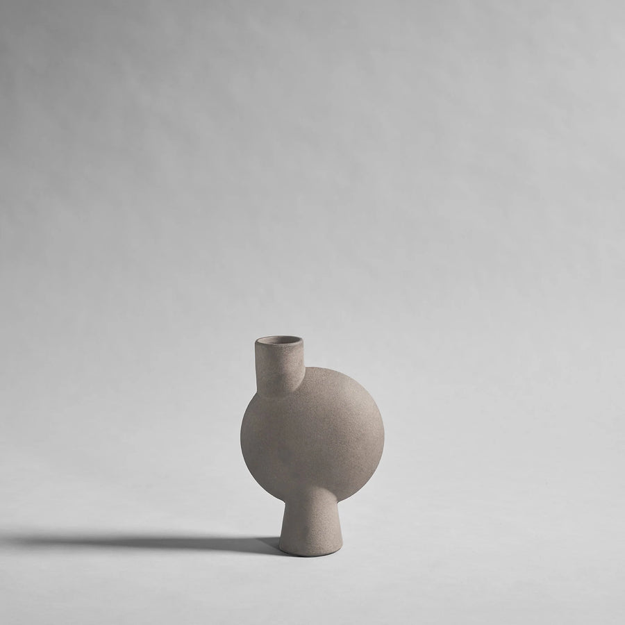 Ceramic sculptural vase on a gray background from 101 Copenhagen at Spacio retail stores in Mumbai & Kolkata. 