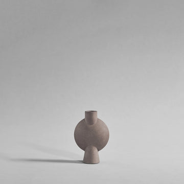Minimalist ceramic vase on a plain background from 101 Copenhagen at Spacio retail stores in Mumbai & Kolkata. 