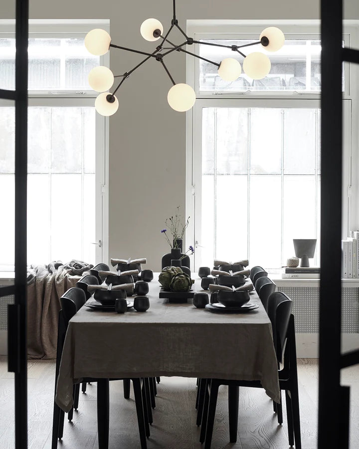 101 Copenhagen collection of nordic style decor accessories along with a decorative chandelier. Styled by Spacio Interior Styling team