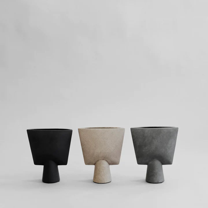 3 vases in different colours in triangle shape from 101 Copenhagen brand made in ceramic. Available at Spacio India