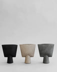 3 vases in different colours in triangle shape from 101 Copenhagen brand made in ceramic. Available at Spacio India