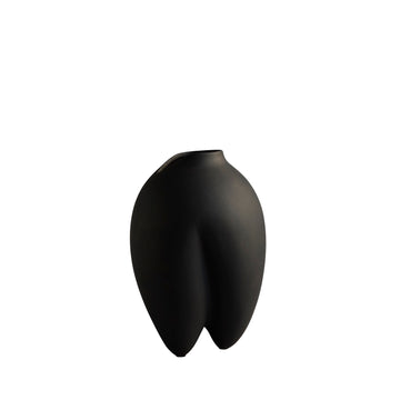 Black abstract vase on a white background from 101 Copenhagen at Spacio retail stores in Mumbai & Kolkata. 