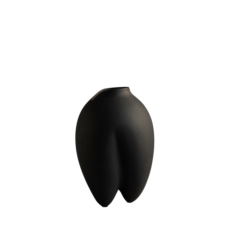 Black abstract vase on a white background from 101 Copenhagen at Spacio retail stores in Mumbai & Kolkata. 