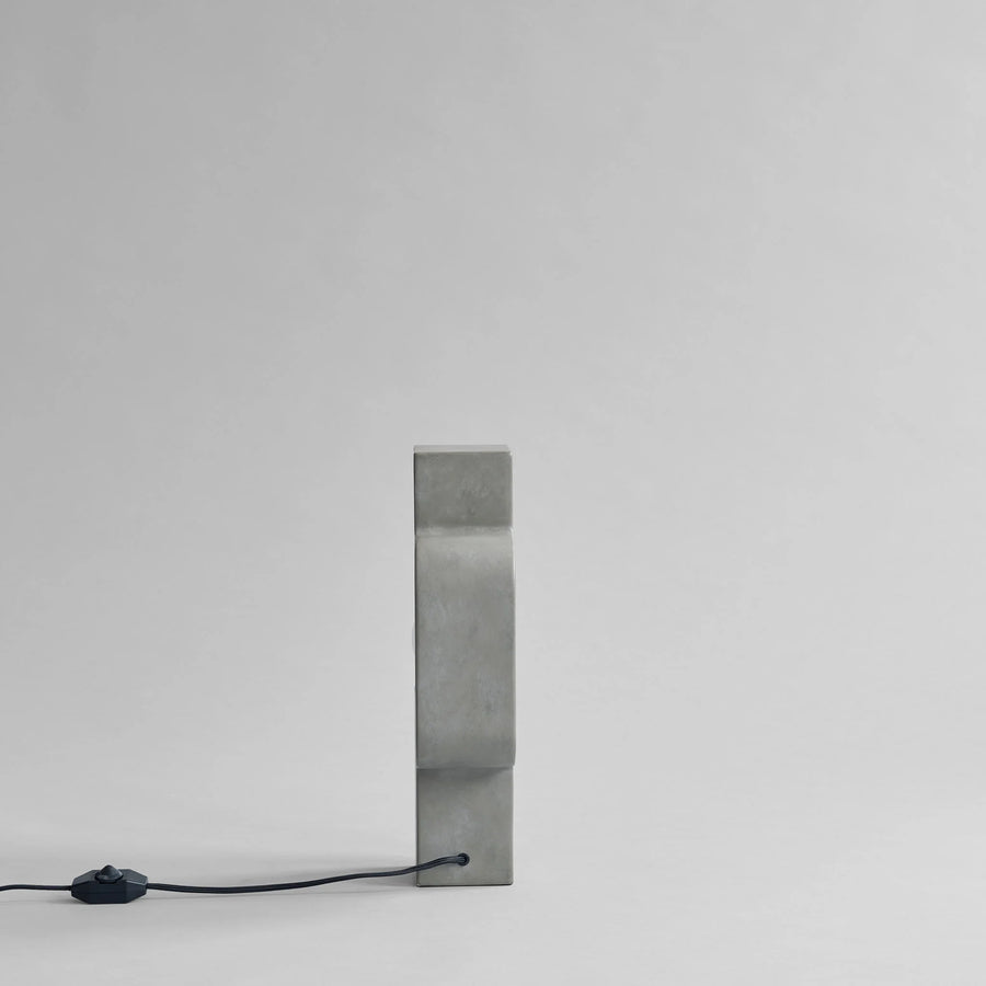 Rectangular mirror with a black power cord on a white background from 101 Copenhagen at Spacio retail stores in Mumbai & Kolkata. 