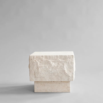 Rectangular limestone plinth on a gray background from 101 Copenhagen at Spacio retail stores in Mumbai & Kolkata. 