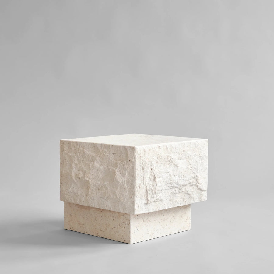 Side view of Rectangular limestone plinth on a gray background from 101 Copenhagen at Spacio retail stores in Mumbai & Kolkata. 