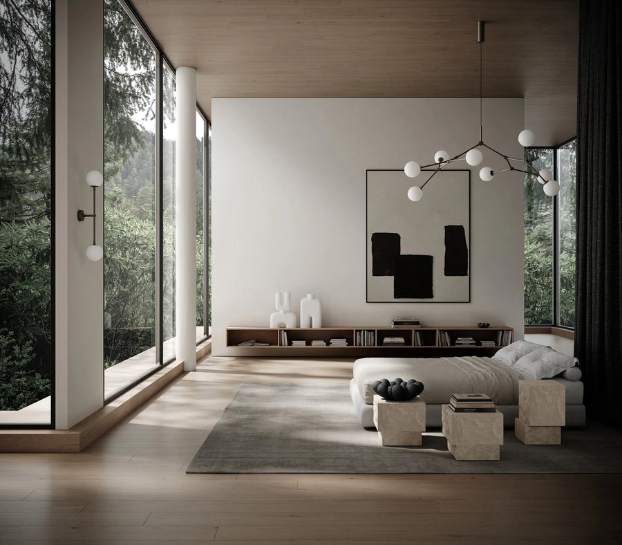 Modern living room with large windows, neutral decor, and a chandelier.