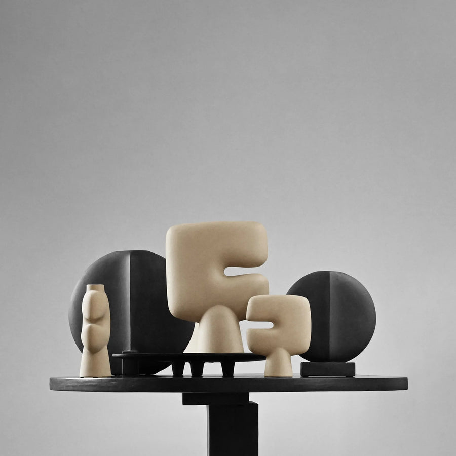 Set of abstract ceramic sculptures on a gray background from 101 Copenhagen at Spacio retail stores in Mumbai & Kolkata. 