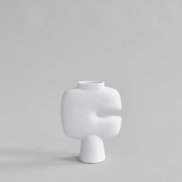 White sculptural vase on a light gray background from 101 Copenhagen at Spacio retail stores in Mumbai & Kolkata. 