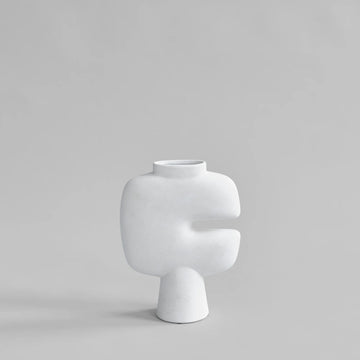 White sculptural vase on a light gray background from 101 Copenhagen at Spacio retail stores in Mumbai & Kolkata. 