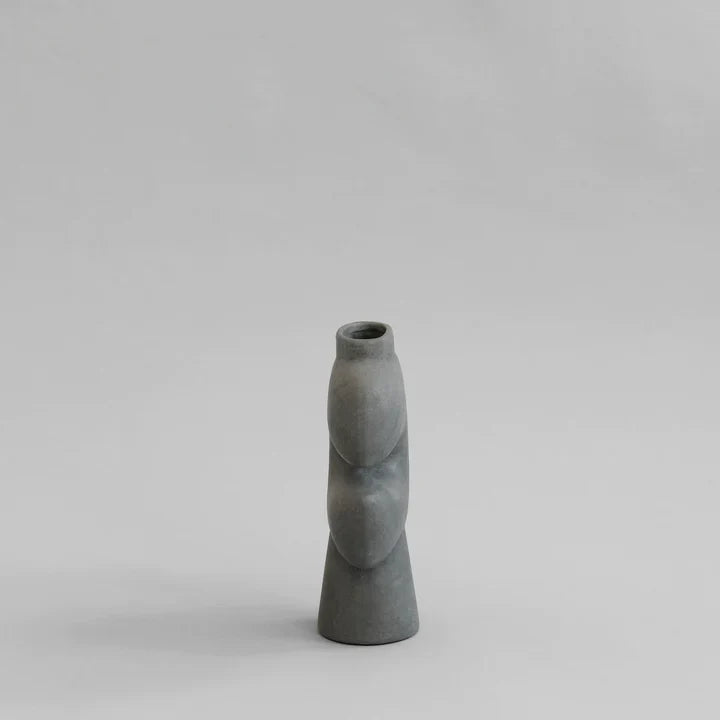 A 101Cph Tribal Vase Medio Dark Grey 214003 by 101 Copenhagen on a dark grey background. Available at Spacio India
