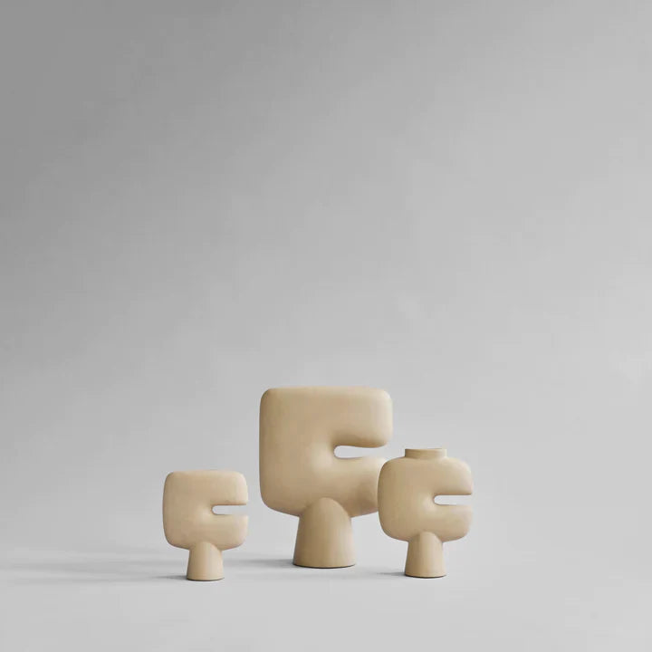 A set of three 101Cph Tribal Vase Mini Sand 221002 by 101 Copenhagen on a grey background. Available at Spacio India