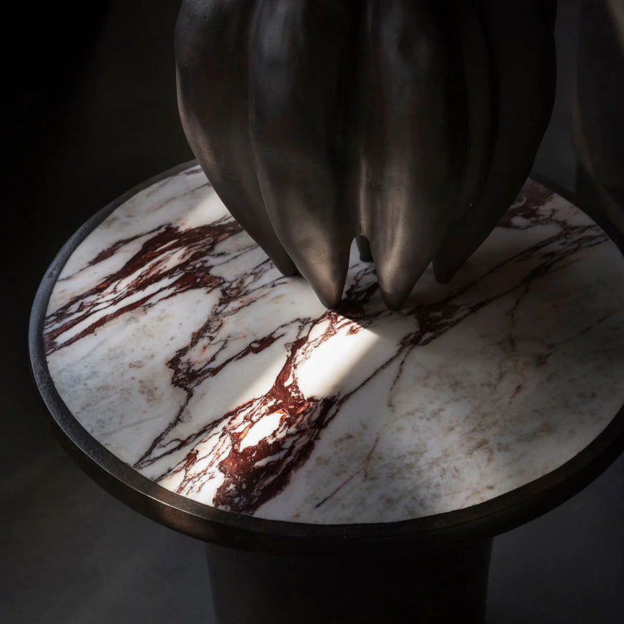 Vase on a calacatta marble top side table with a dark background from 101 Copenhagen at Spacio retail stores in Mumbai & Kolkata. 