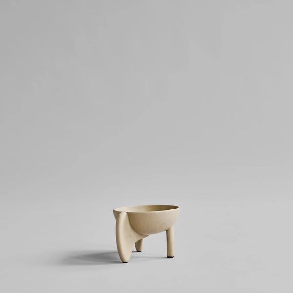Beige ceramic planter on a light gray background from 101 Copenhagen at Spacio retail stores in Mumbai & Kolkata. 