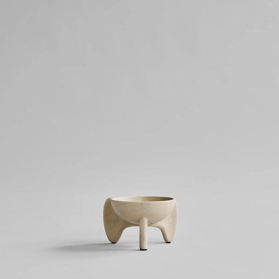 Beige ceramic planter on a light gray background from 101 Copenhagen at Spacio retail stores in Mumbai & Kolkata. 