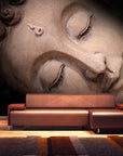 Close-up fresco mural of a Sleeping Buddha's face, crafted with Italian plaster using Carrara marble and travertine powder, showcasing intricate, serene details. Featured on a wall of double height in a luxury modern living room