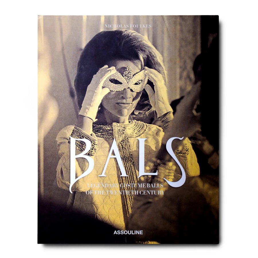 A woman wearing an Assouline Coffee Table Book Bals: Legendary Costume Balls of the Twentieth Century costume party mask.