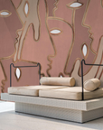 A seating room with an Affreschi wall design featuring a pink and beige mural from the Affreschi Season 1 Collection.